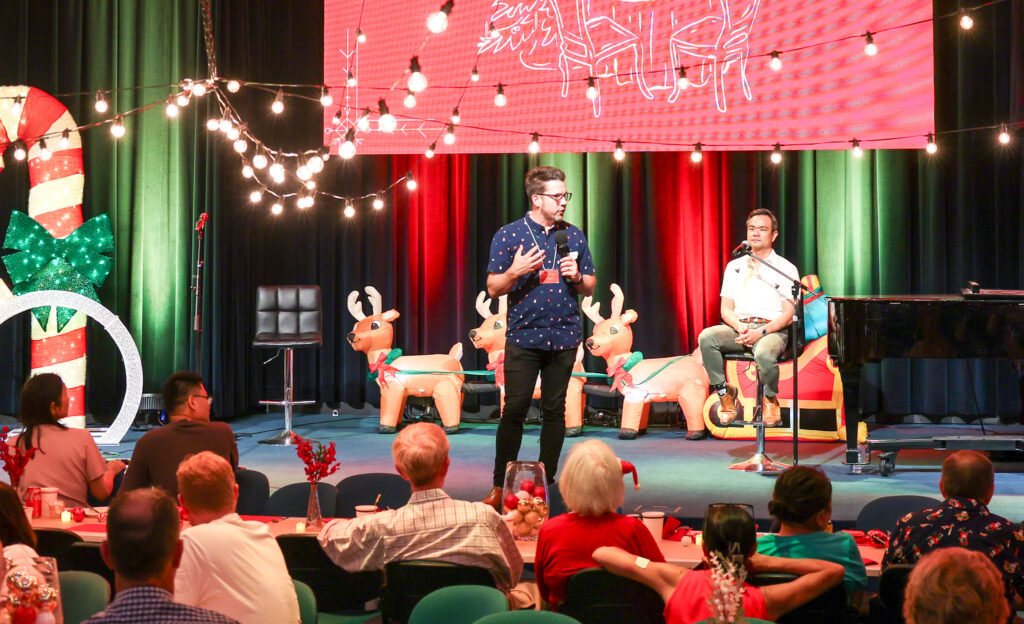 Entertainment and encouragement on stage at Northside Christmas lunch