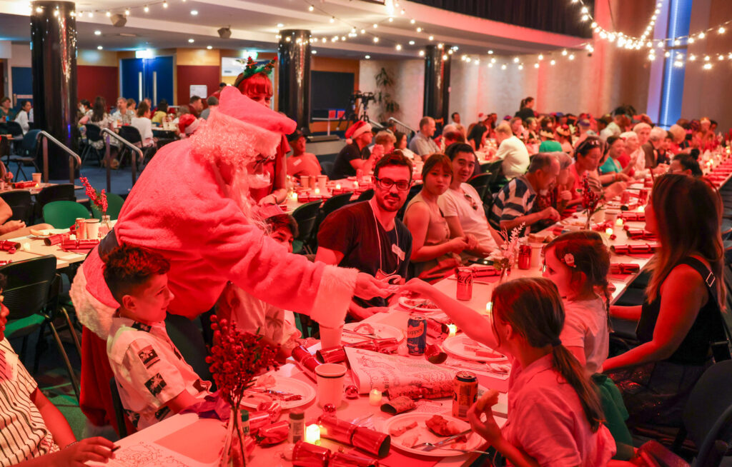 Santa bringing treats to the crowd at Northside Christmas lunch.